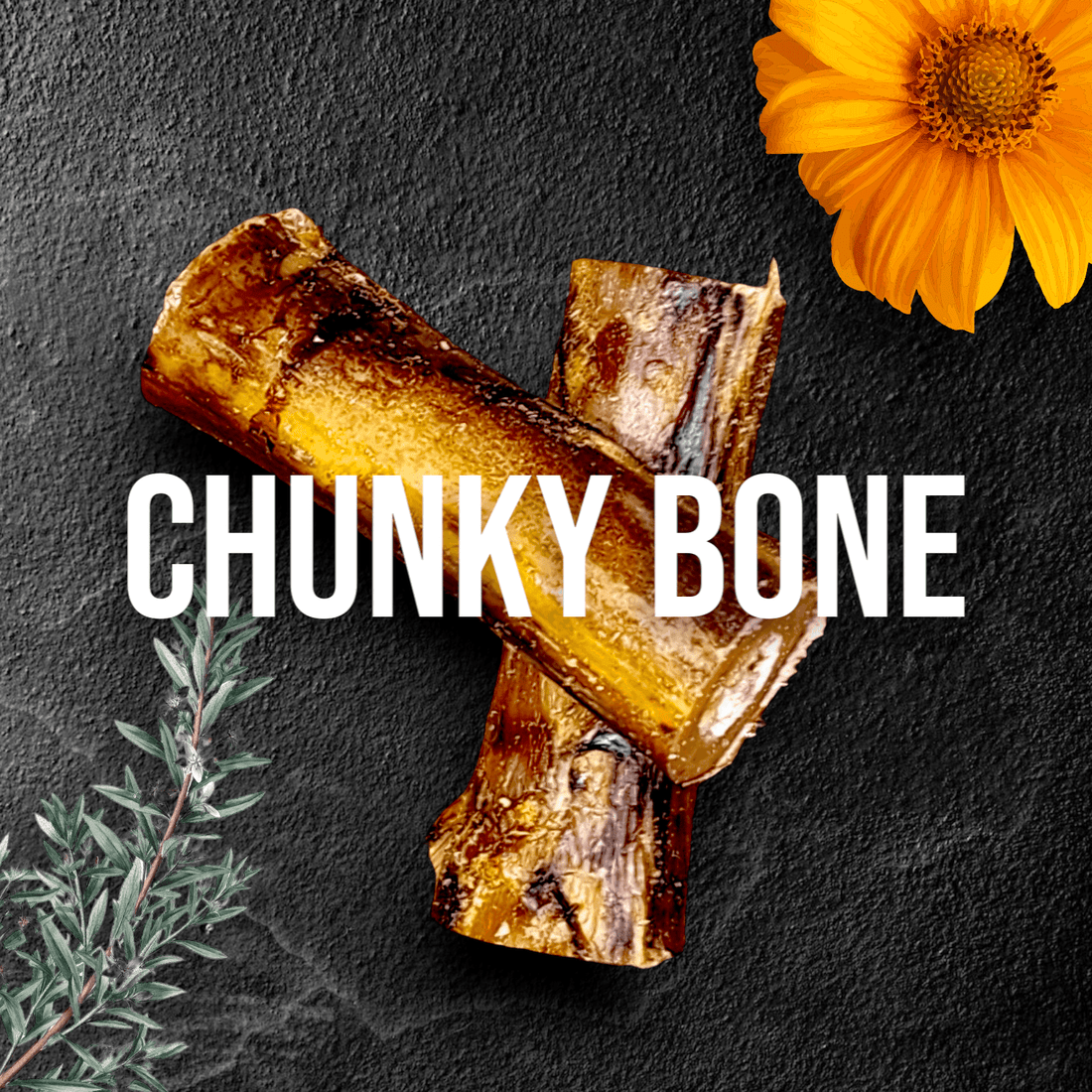 Two roasted bones crossed with orange flower and green herbs on dark background.